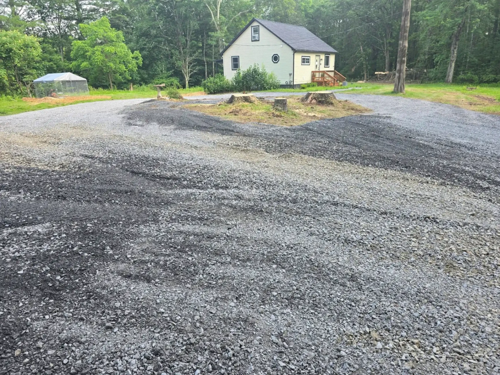 Stump grinding on driveway project